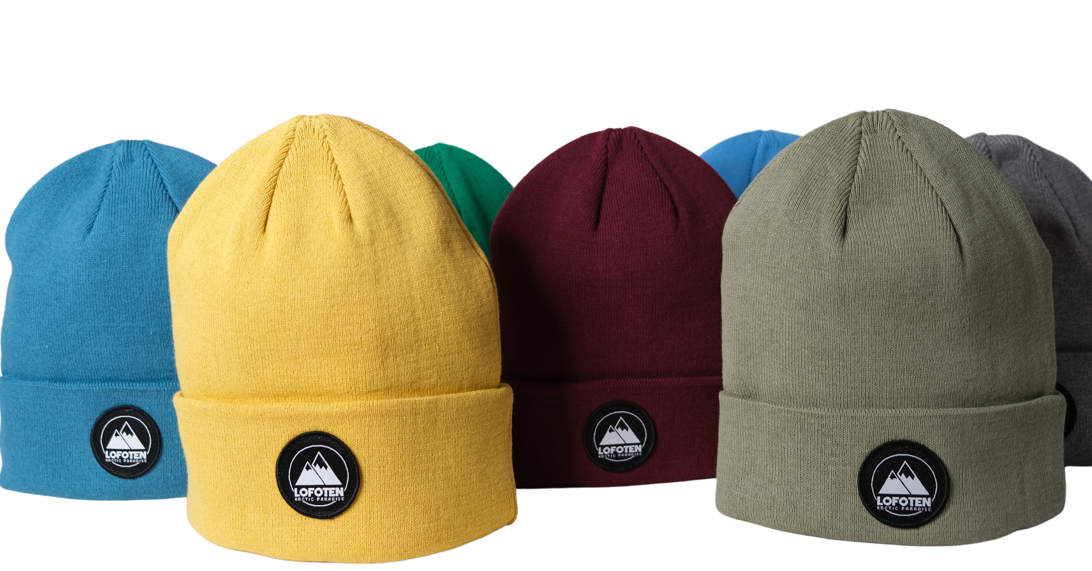 Seven Lofoten beanies in different colors, round Lofoten logo.