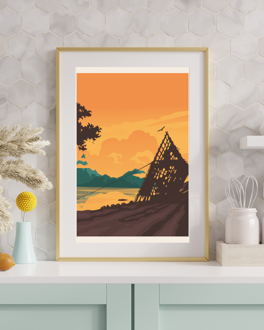 Framed artwork of the arctic midnightsun in Lofoten, Norway. Empty fishing rack with a mountain landscape on a wall above a cabinet.