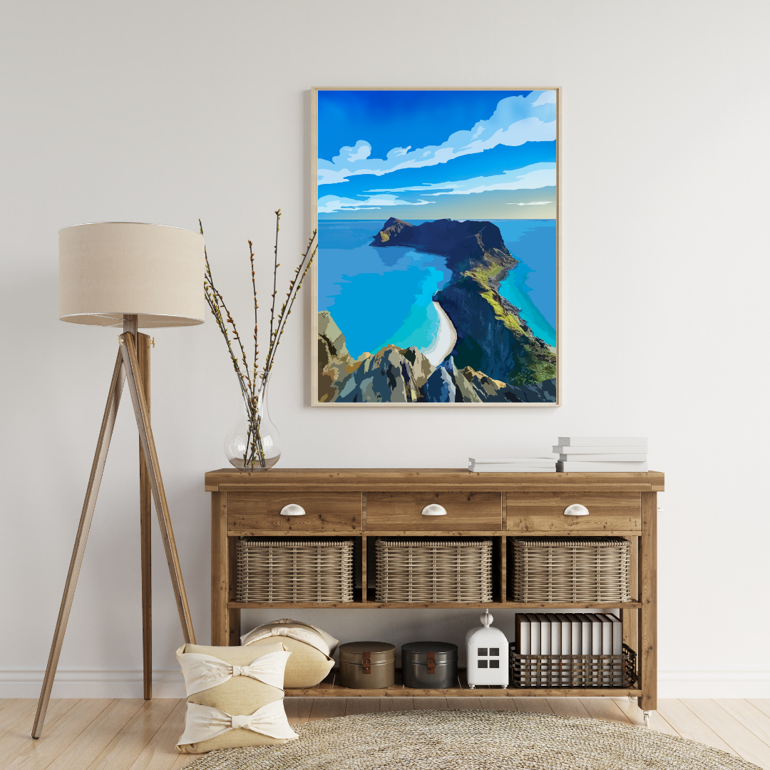 Living room with wooden console table, lamp, and a painting of the Håen hike at Værøy in Lofoten, Norway.