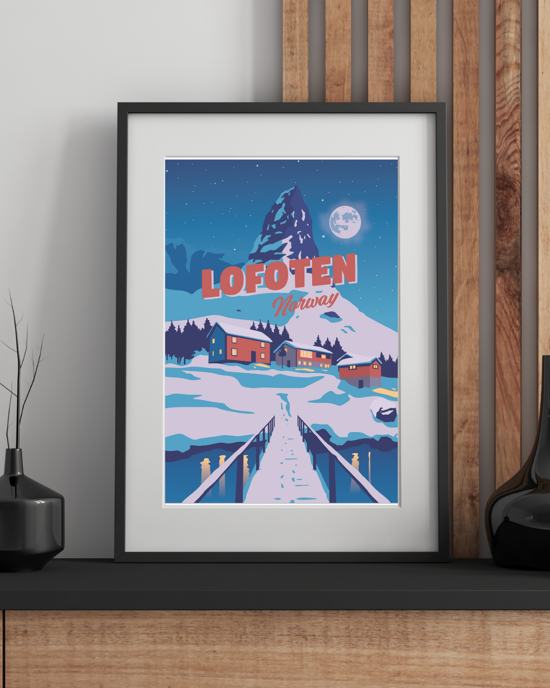 Framed winter poster from Hammarskaftet in Reine, Lofoten, Norway with a snowy landscape and wooden walkway.
