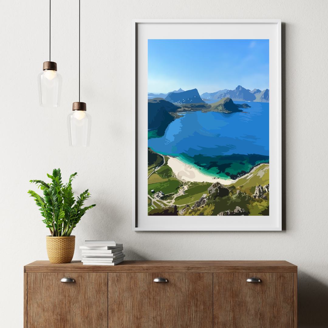Framed landscape print of Haukland beach in Lofoten, view from Mannen hike, displayed on a wall above a wooden cabinet.