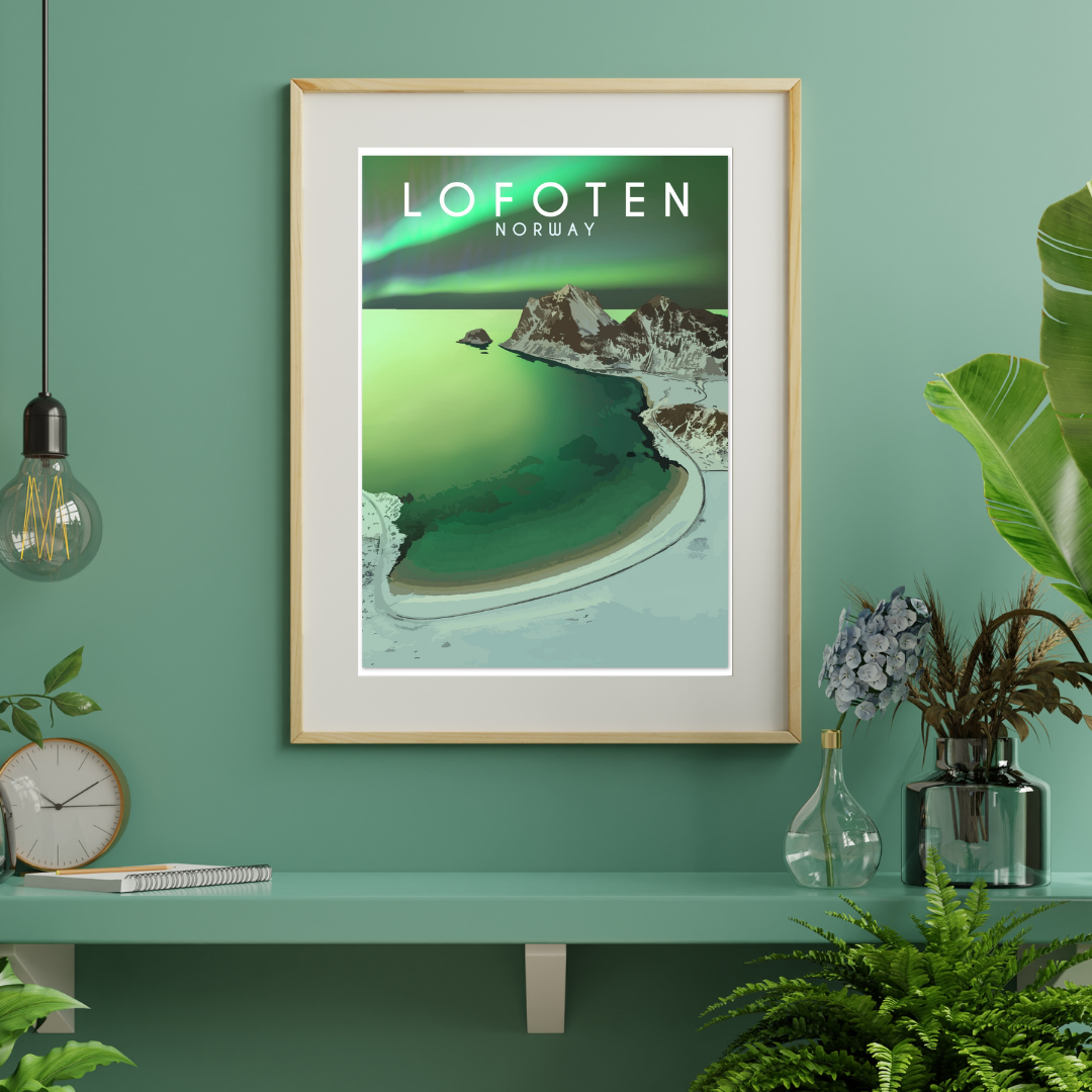 Framed artwork of Haukland beach in Lofoten, Norway with a green and blue color scheme on a teal wall. Northern lights are dancing on the sky above the beach.
