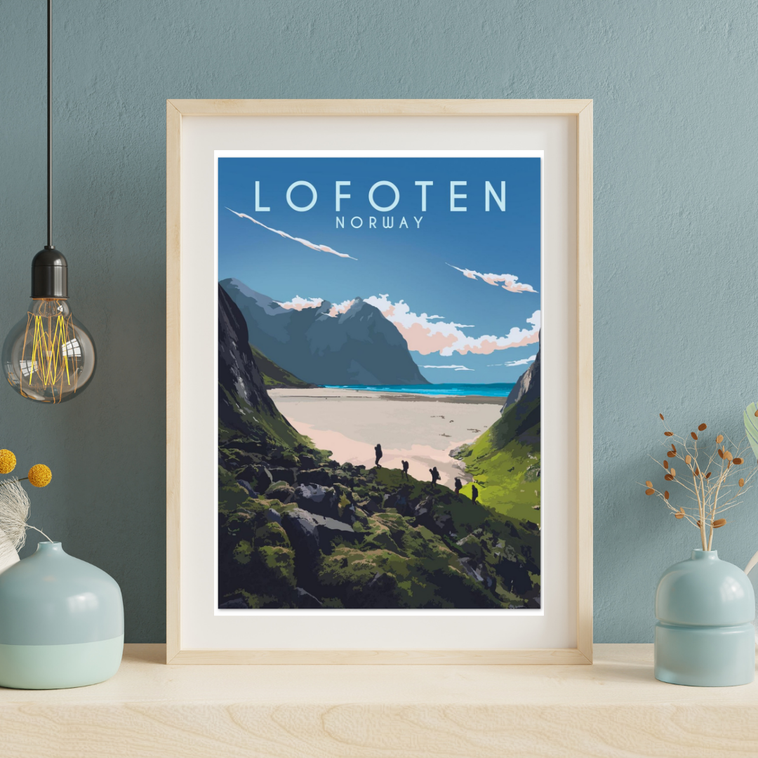 Framed poster from the hike to Kvalvika beach in Lofoten Norway. Colors are blue, grey and green and the text says Lofoten Norway. Standing on a shelf with vases and a hanging lamp.