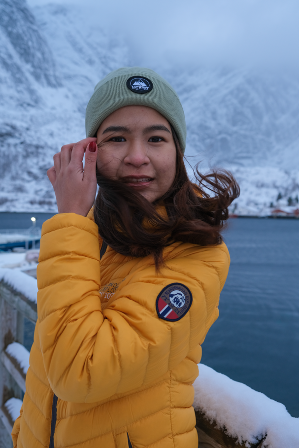 Yellow lady down jacket, Reine Lofoten