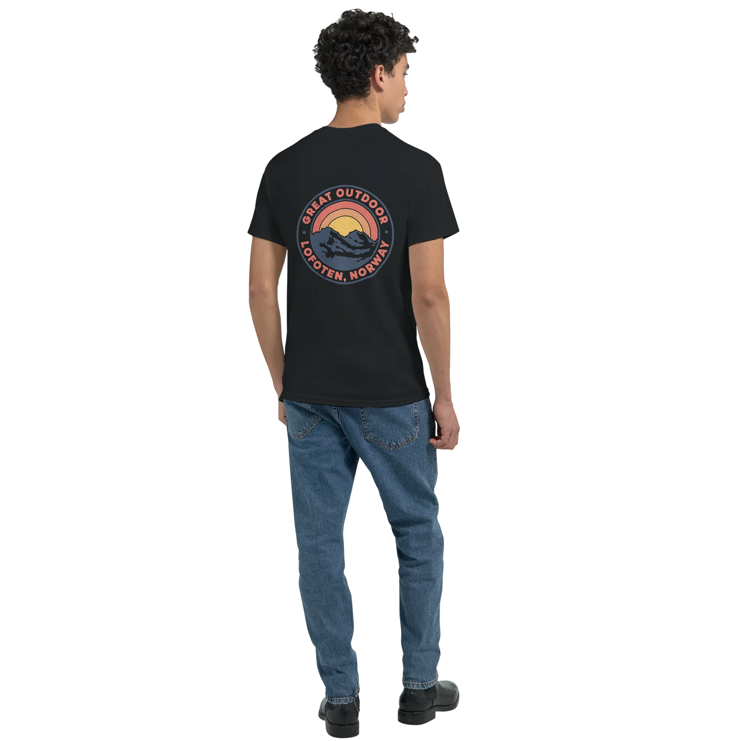 Youth wearing a black t-shirt with print on the back which says Great Outdoor Lofoten Norway. Colors of print is yellow and orange.