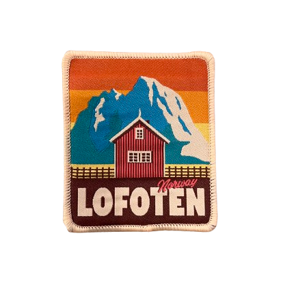 Patch from Lofoten in retro yellow colors. Mountain in the background, house in the front. Text says Lofoten Norway.