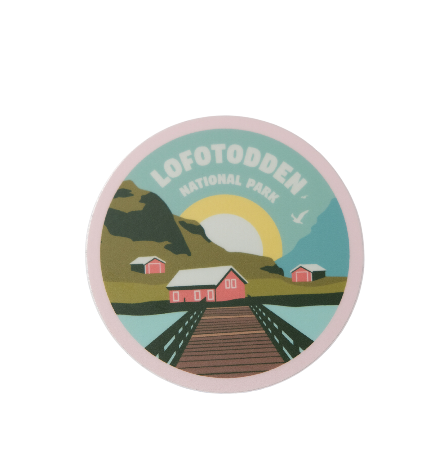Round sticker from Lofotodden National Park in Lofoten. The sticker has fishermans huts and midnight sun in it.