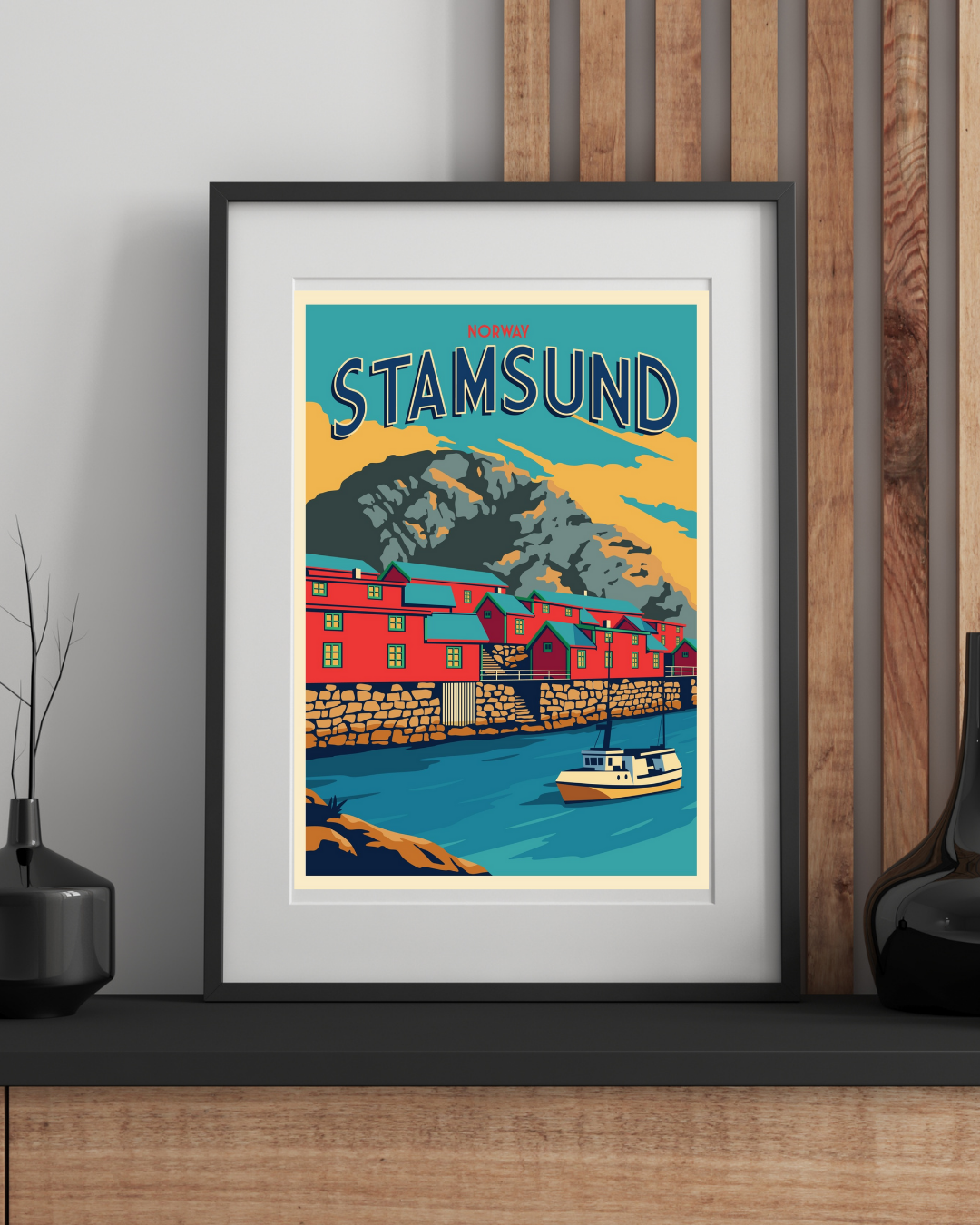 Framed poster of Stamsund in Lofoten with a scenic design on a wall.