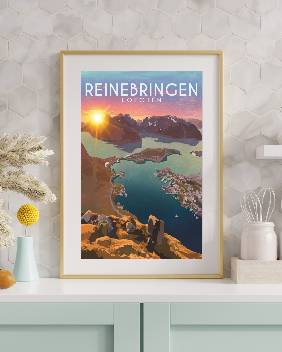 Framed poster of Reinebringen in Reine Lofoten with the perfect senic view from the top, on a wall.