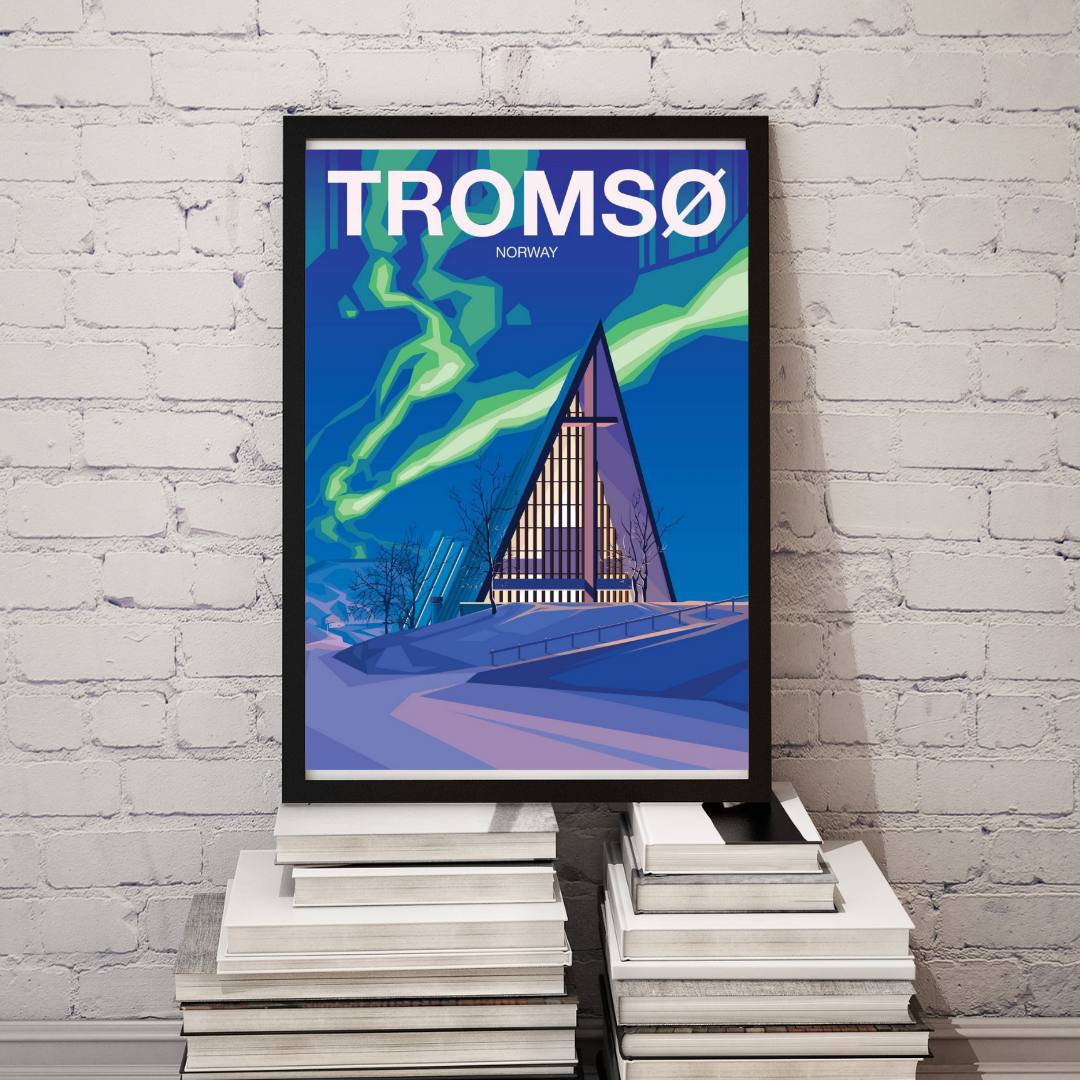 Framed picture of Ishavskatedralen in Tromsø Norway. Winter with snow and dancing aurora. Colors are blue and green and the text says Tromsø Norway.