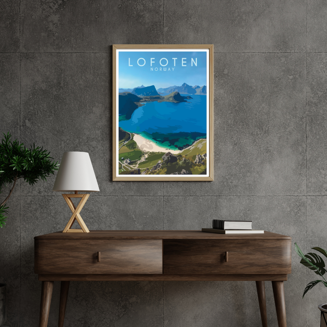Framed artwork of Haukland beach in Lofoten, Norway on a gray wall above a wooden console table.