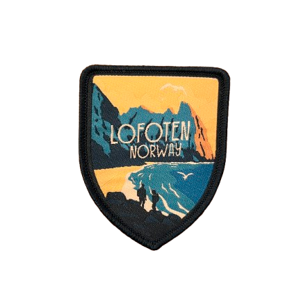 Patch from Kvalvika Beach in Lofoten. Siluette from two hikers. Text says Lofoten, Norway and the colors are sandy yellow and sea blue. 