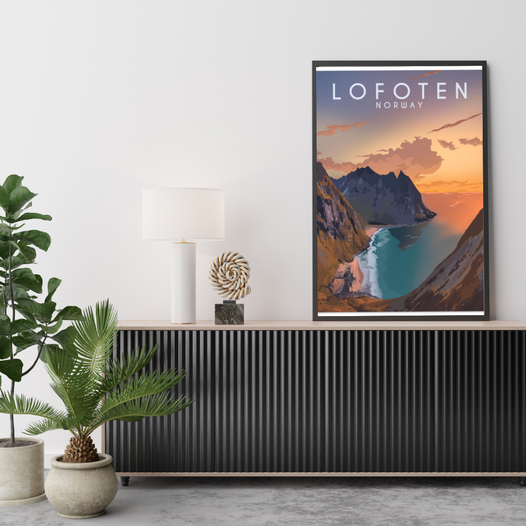 Framed poster from Ryten in Lofoten, with a view over Kvalvika beach, Norway on a wall above a console table with decorative items.