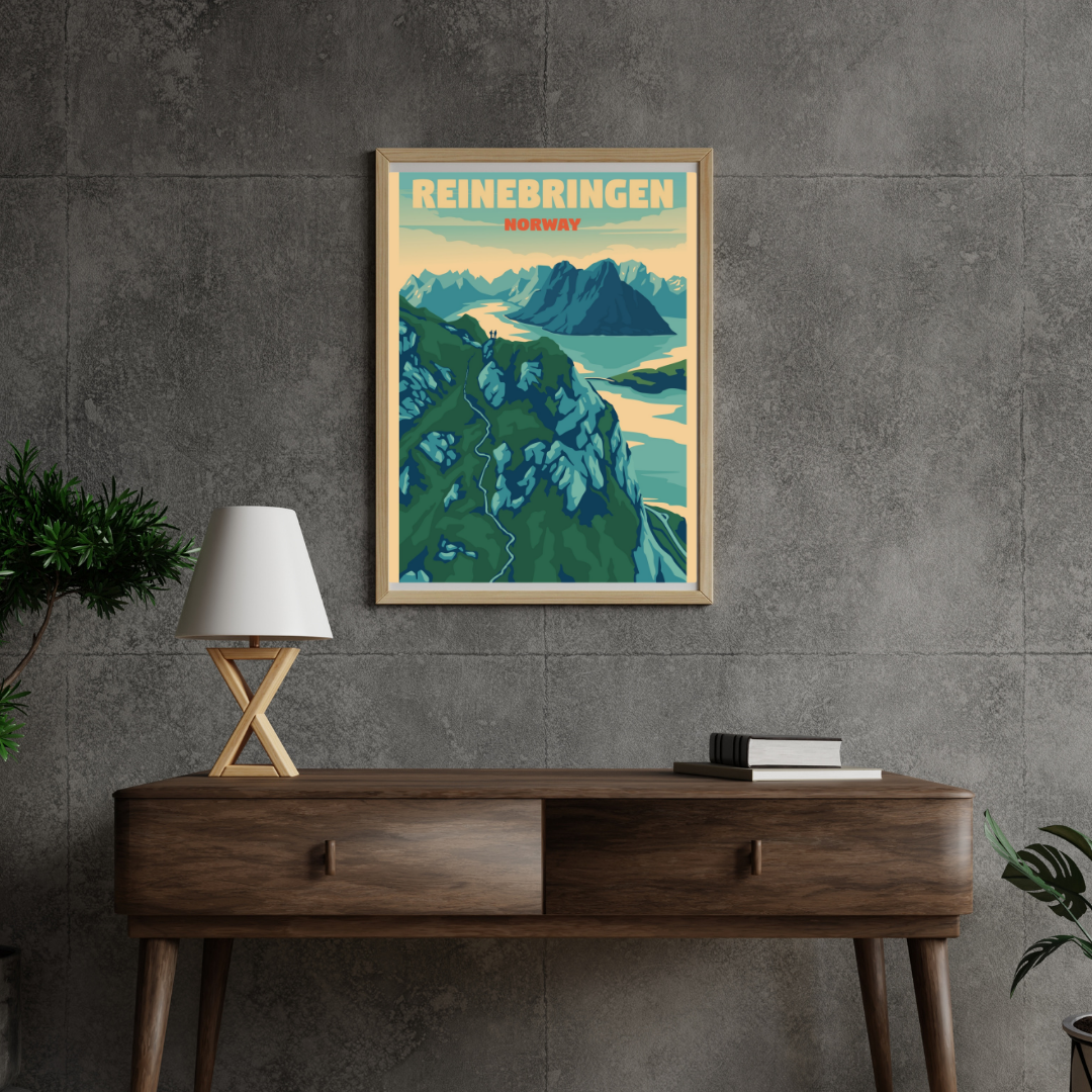 Framed picture on a grey wall. Motive is Reinebringen in Reine, Lofoten. View from the top over the Reinefjord. 