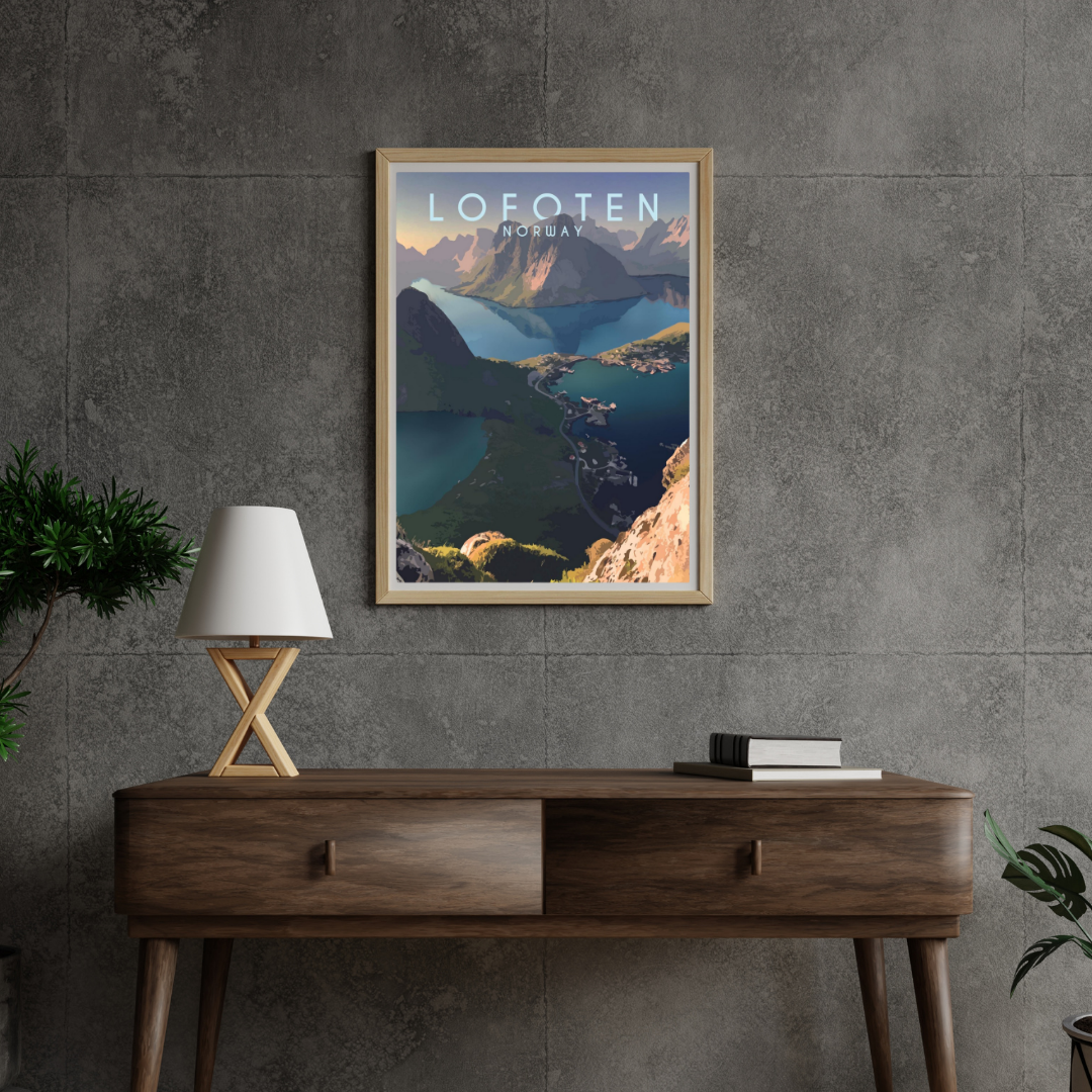 Framed poster from the top of Reinebringen in Lofoten, Norway on a gray wall above a wooden console table.