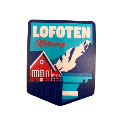 Sticker in red, blue and white colors. Text is Lofoten Norway. Red rorbu, or fishermans cabin in the front. Sea and mountains behind. 